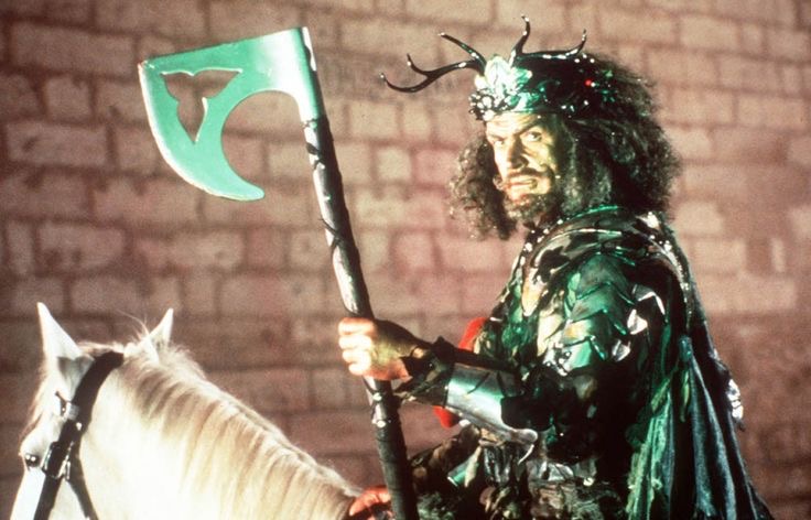 Sean Connery on a white horse, wearing elaborate armor and a horned headpiece. He is holding an axe. The best part is the poofy, frizzy shoulder-length hair he is sporting.