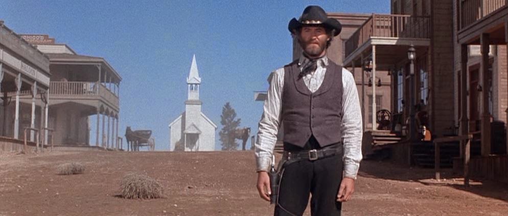 I guess it's Kevin Kline dressed as a cowboy in front of a Western town. Looks like a shootout is about to occur. Maybe I should watch any of these movies.