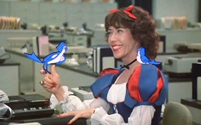 Lily Tomlin as Snow White with cartoon birds perched on her.