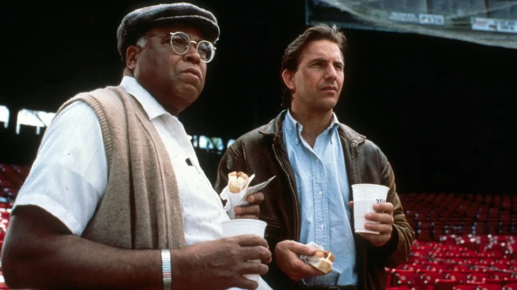 James Earl Jones and Kevin Costner enjoy ballpark snacks in a ballpark with no other fans.