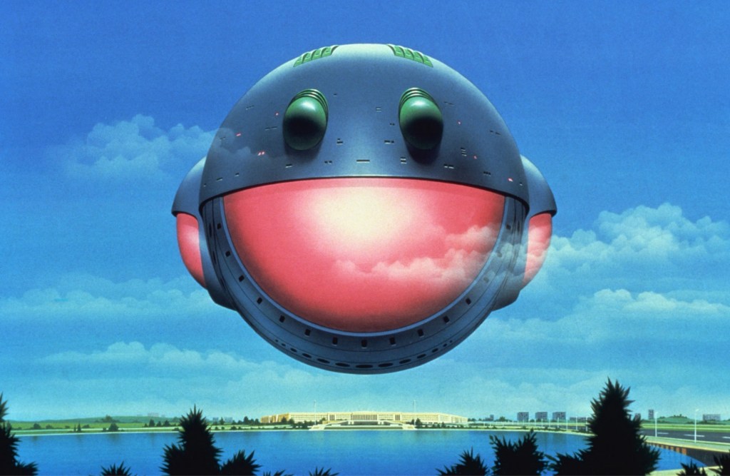 A space ship, maybe, that looks like a happy face, with a wide window that looks like a smile but it's all pink. The sky is lovely, light blue with fluffy clouds, and the ship, or whatever, floats above water. It very much looks like an album cover from the late 70s.