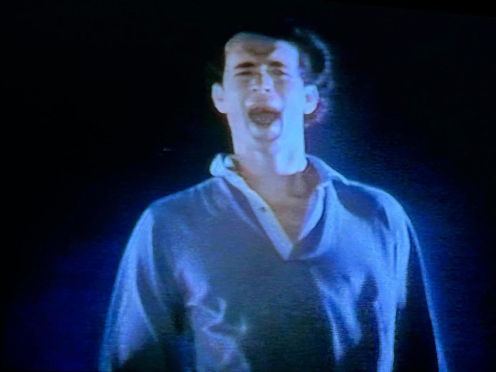 A young Tom Hanks yelling