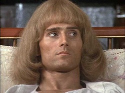 Okay, from what I can tell, this is Murray Head, brother of Anthony Stewart (Giles and the jackass from Ted Lasso) Head. Murray is a live-action He-Man doll. His hair is a stunning 70s grown-out pageboy.