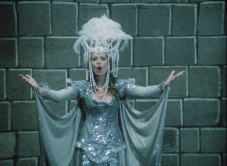 Okay there's a possibly-singing blonde woman and she's in this amazing silver dress with those sort of wing things attached to the wrists and a giant headdress. She's rocking this and I'm afraid to wear the silver leggings my friend gave me? I'm not living my best life, OBVIOUSLY.