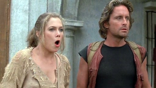 Kathleen Turner, mouth open in surprised, and Michael Douglas with the longest hair I've ever seen him have and it's a great style for him
