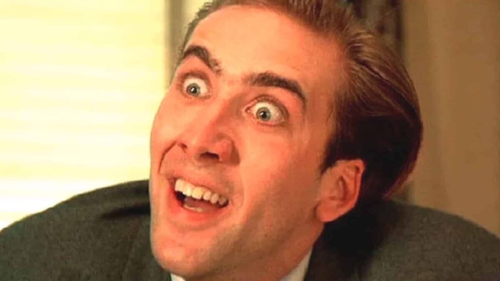 The face that launched a thousand memes...Nicolas Cage close-up, eyes wide, head slightly tilted, nostrils flaring