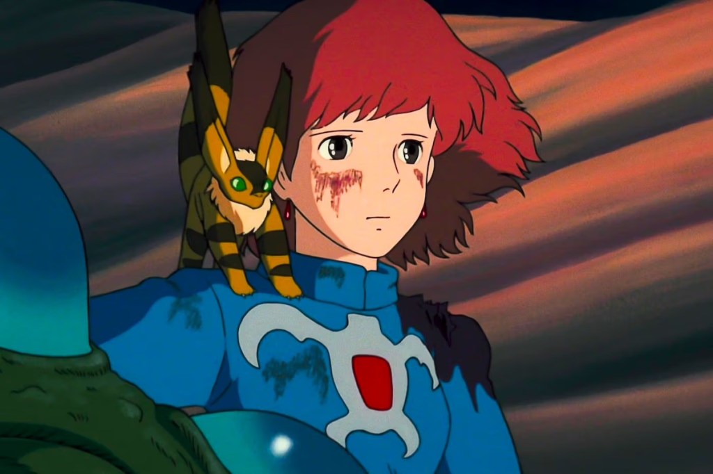 A young, red-haired person is dirty and/or injured with some sort of Pokemon on her shoulder. Not an Evee but something like an Evee.