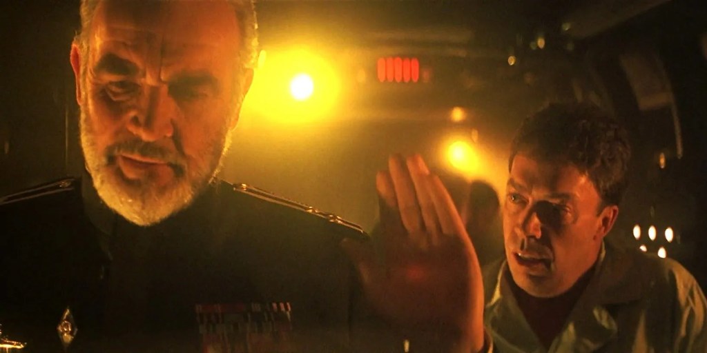 Sean Connery waves away Tim Curry's concerns while stealing a sub. This is Dennis's alt text from Bluesky.
